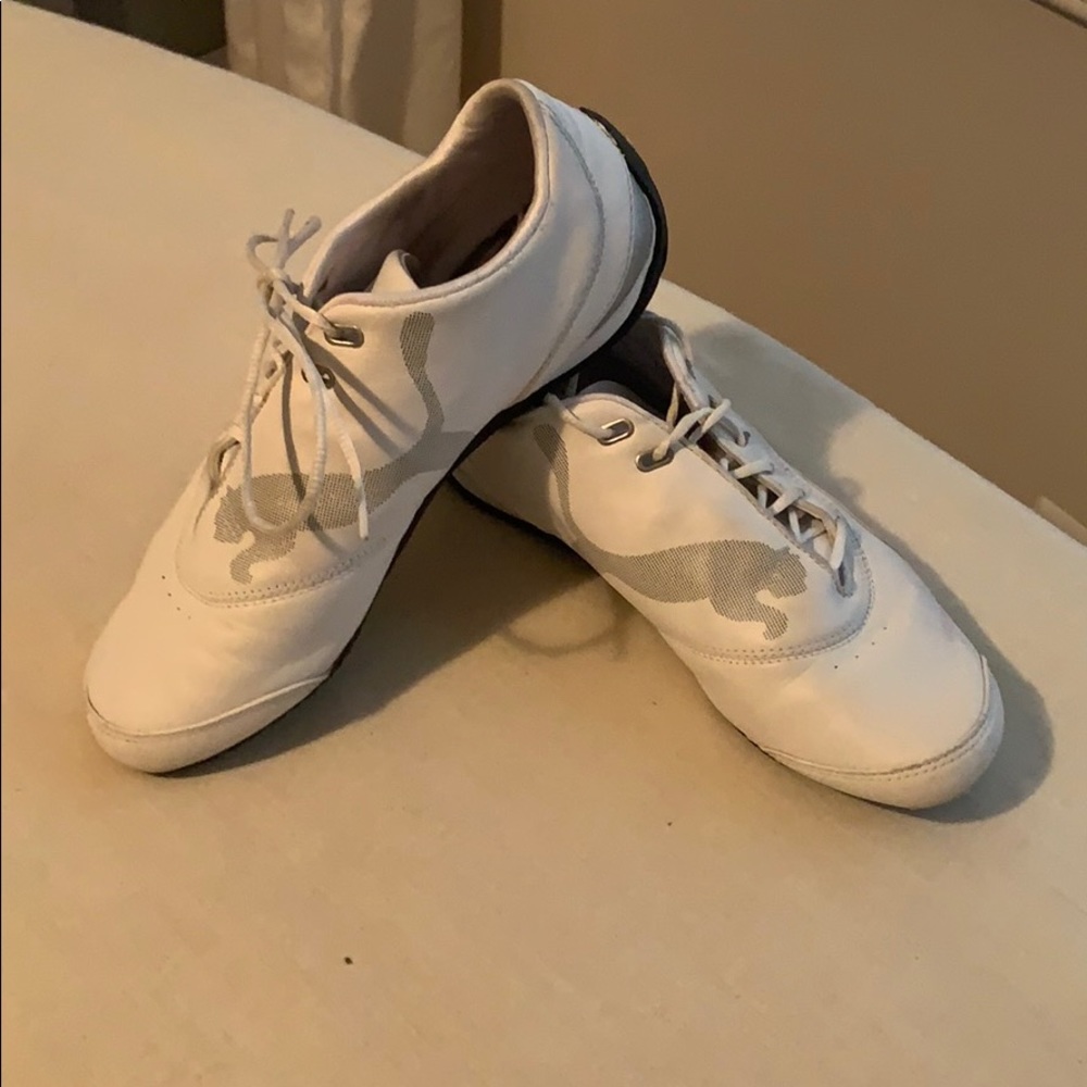 White and Pink PUMA tennis shoes